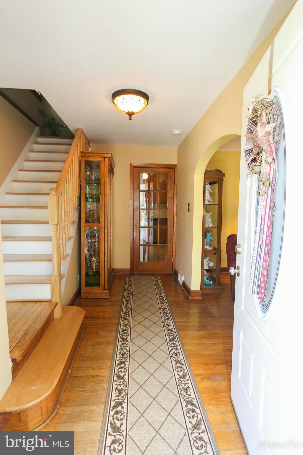 340 Devonshire Road Hagerstown, MD 21740 - Photo 4 of 26 a view of a hallway with wooden floor and furniture