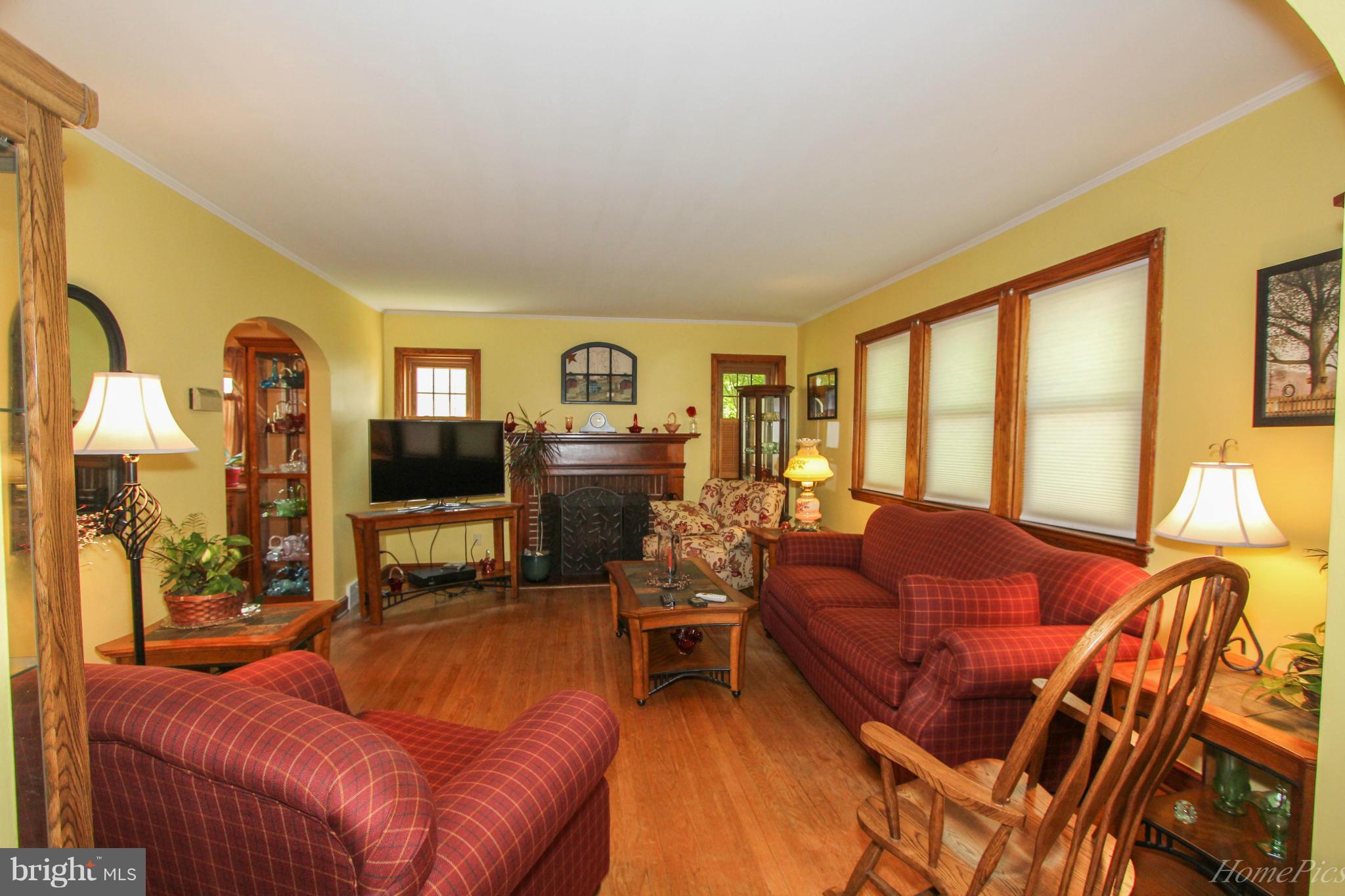 340 Devonshire Road Hagerstown, MD 21740 - Photo 6 of 26 a living room with furniture a flat screen tv and floor to ceiling window