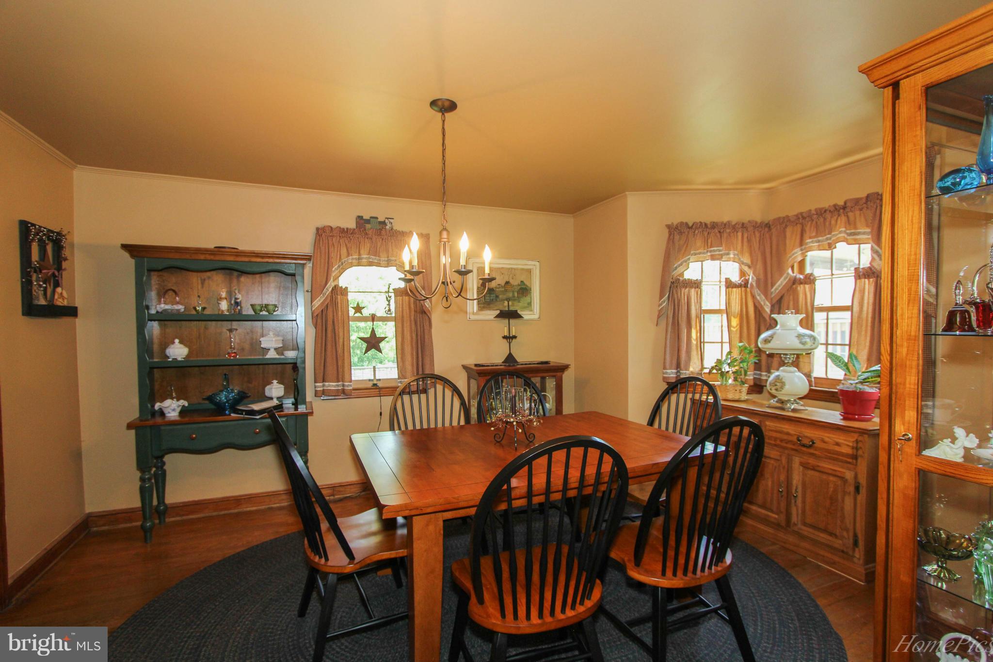 340 Devonshire Road Hagerstown, MD 21740 - Photo 9 of 26 a dining room with furniture a chandelier and window