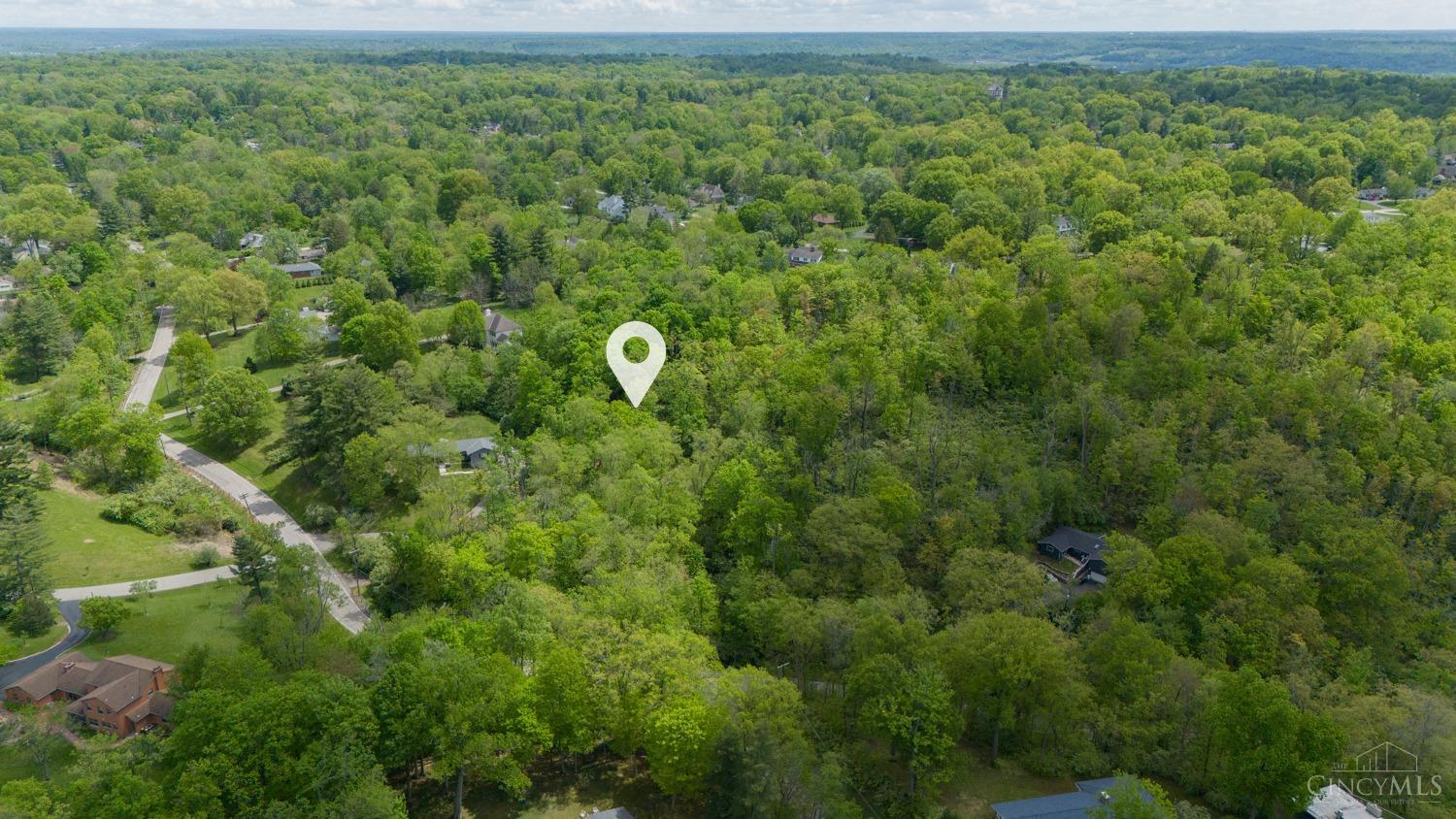 7335 Demar Road Cincinnati, OH 45243 - Photo 1 of 8 The Village of Indian Hill's prestigious ambiance sets the stage for your ideal lifestyle, combining tranquility with proximity to urban amenities. With commute times under 10 minutes to I-71 and St Rt 50, and just thirty minutes to the Greater Cincinnati airport, you'll enjoy unparalleled convenience without compromising on serenity.