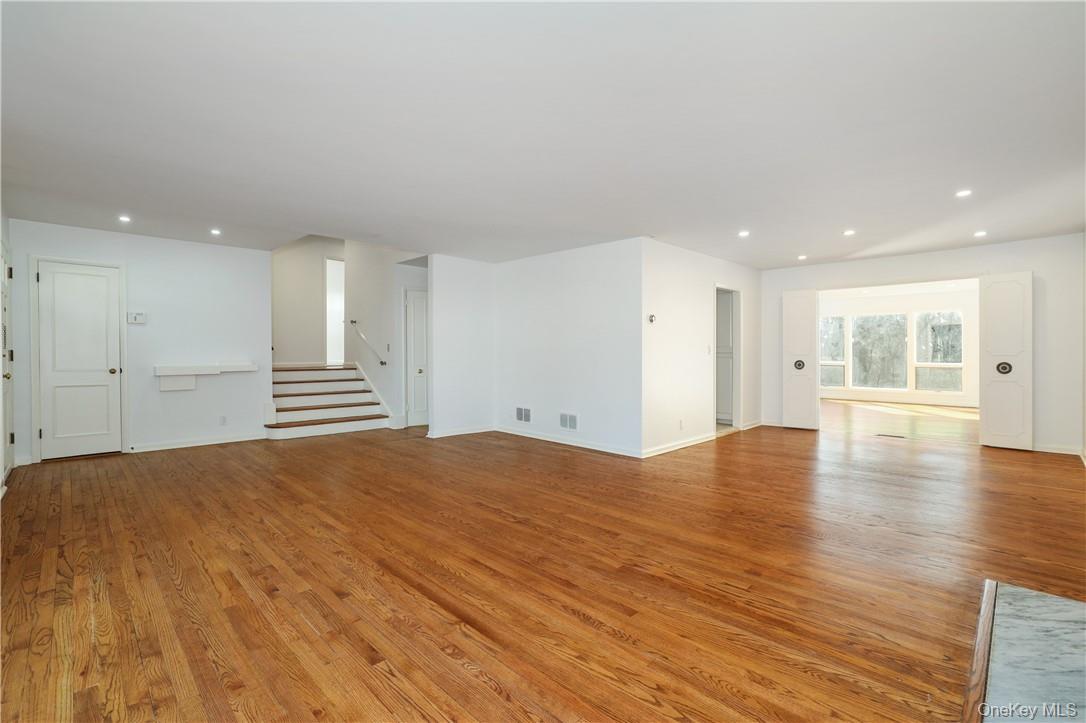 65 Lincoln Road Scarsdale, NY 10583 - Photo 6 of 29 Living room with view of dining room and family room