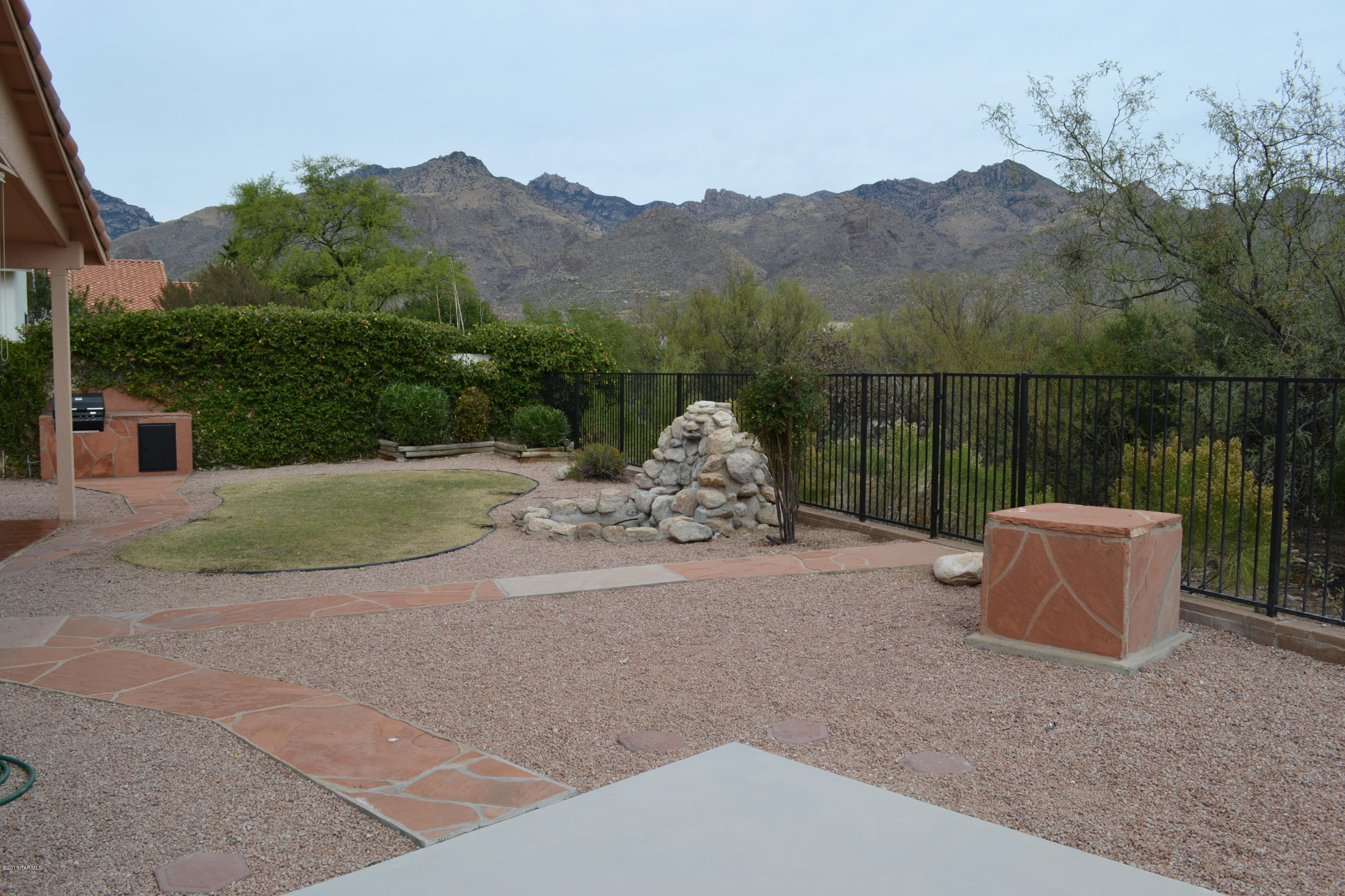 5640 North Cherokee Ridge Road Tucson, AZ 85750 - Photo 29 of 39 a terrace of a house with outdoor seating