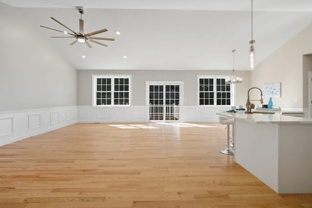 a view of a kitchen with a sink and cabinet with a fireplace