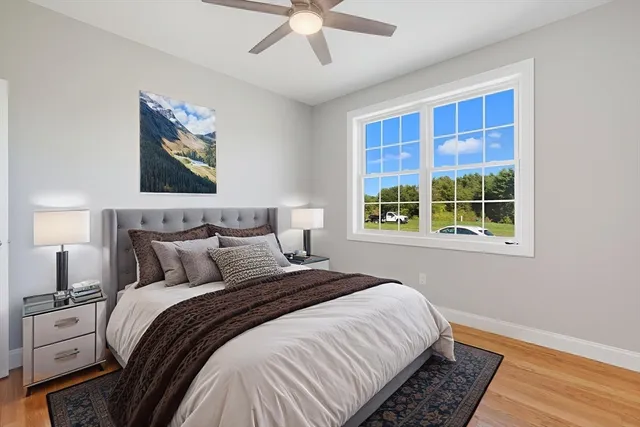 a bedroom with bed and a window