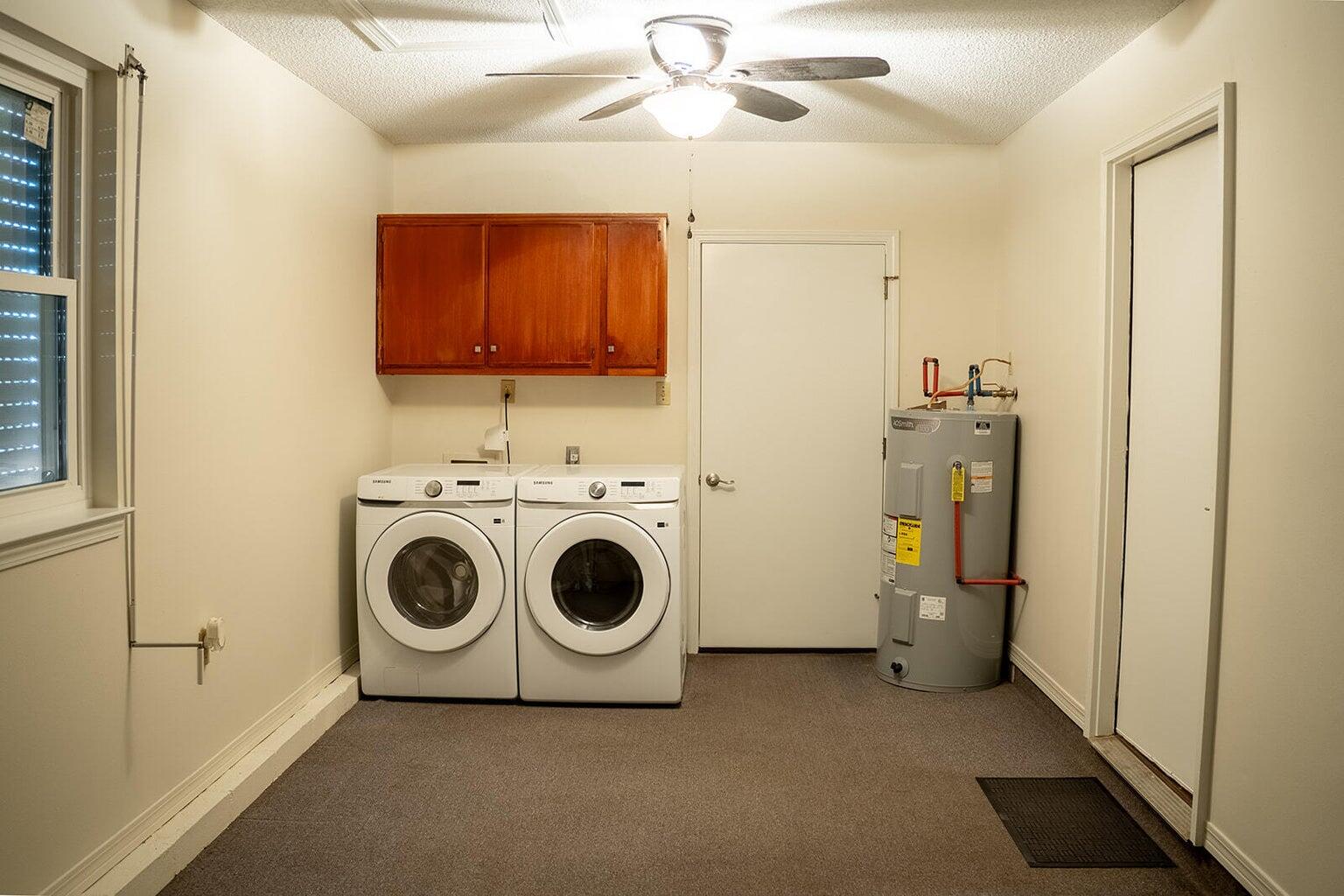 4868 Griffith Mill Road Holt, FL 32564 - Photo 28 of 32 a utility room with dryer and washer