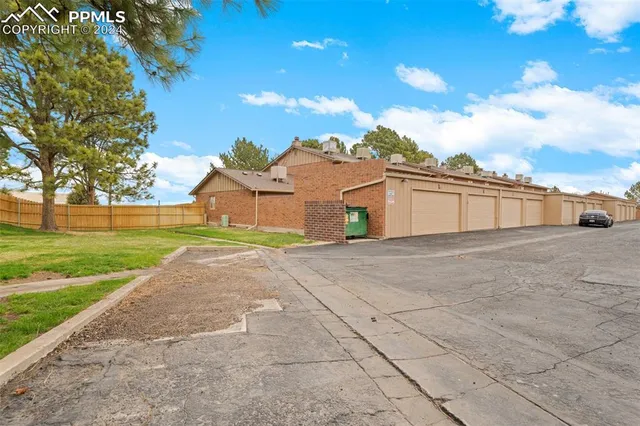 a view of a big yard with palm trees