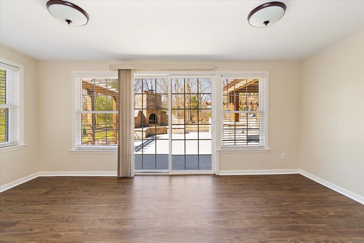 2609 Derby Run Road Springfield, TN 37172 - Photo 12 of 48 an empty room with wooden floor and windows