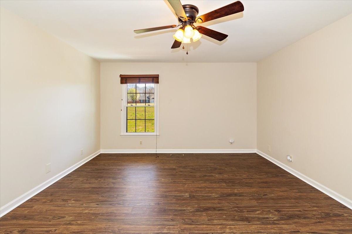 2609 Derby Run Road Springfield, TN 37172 - Photo 17 of 48 a view of an empty room with wooden floor and a window