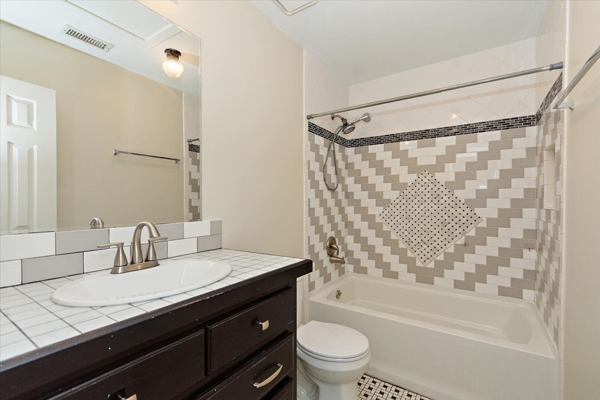2609 Derby Run Road Springfield, TN 37172 - Photo 24 of 48 a bathroom with a granite countertop sink a toilet and shower