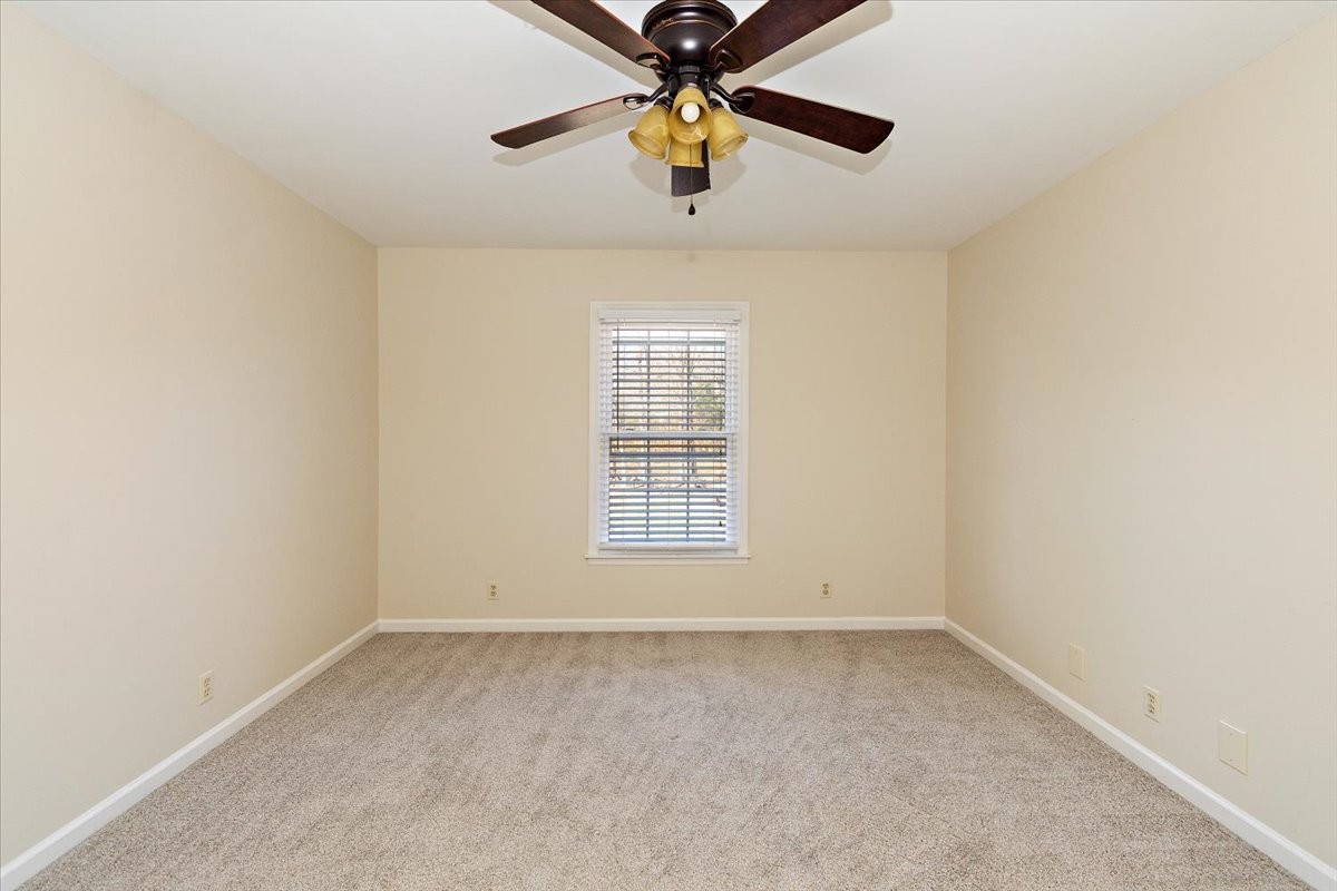 2609 Derby Run Road Springfield, TN 37172 - Photo 25 of 48 an empty room with chandelier fan and windows