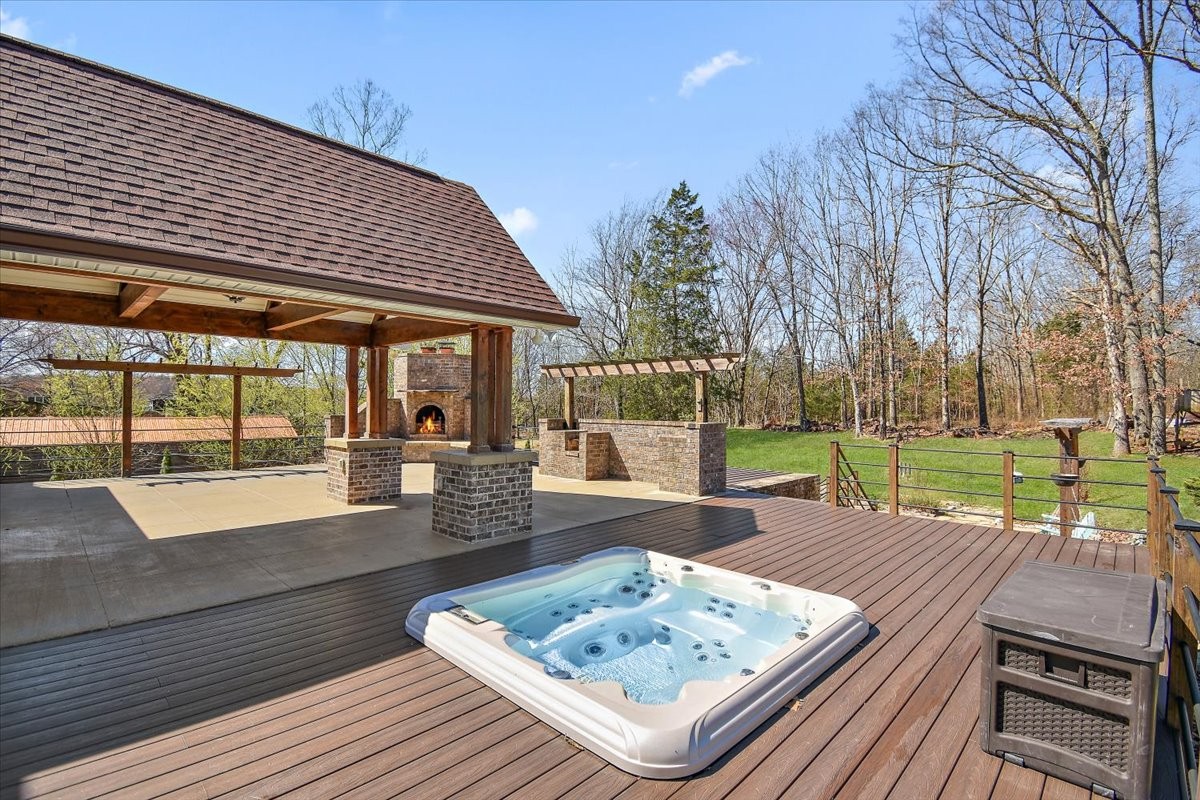 2609 Derby Run Road Springfield, TN 37172 - Photo 29 of 48 a view of a patio with wooden floor table and chairs