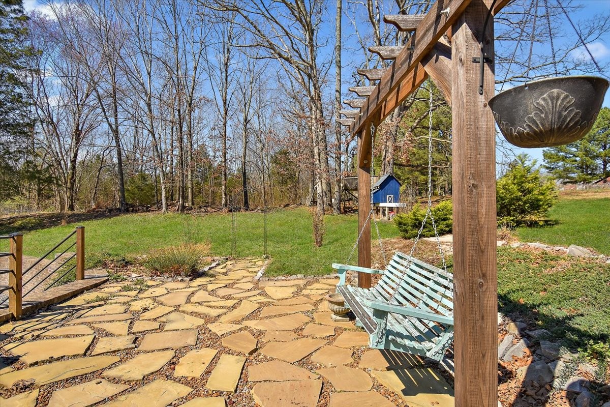 2609 Derby Run Road Springfield, TN 37172 - Photo 33 of 48 a view of a garden with a bench