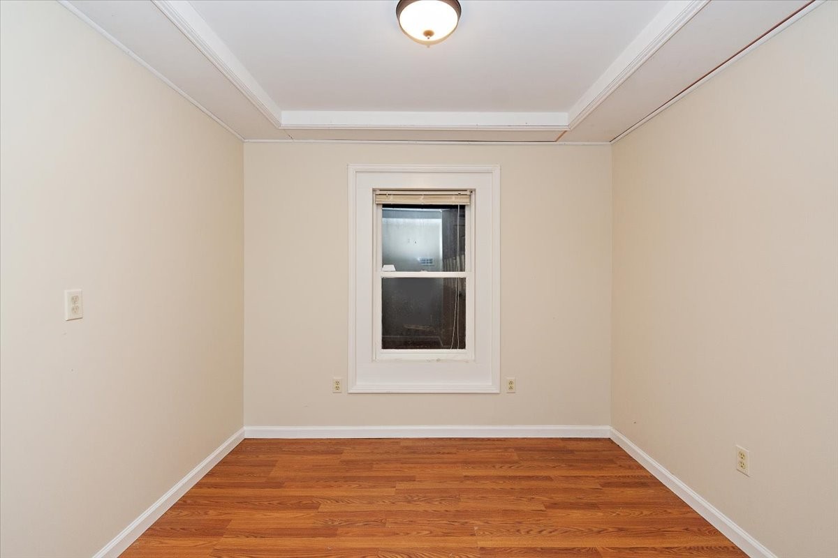 2609 Derby Run Road Springfield, TN 37172 - Photo 40 of 48 a view of an empty room with wooden floor and a window