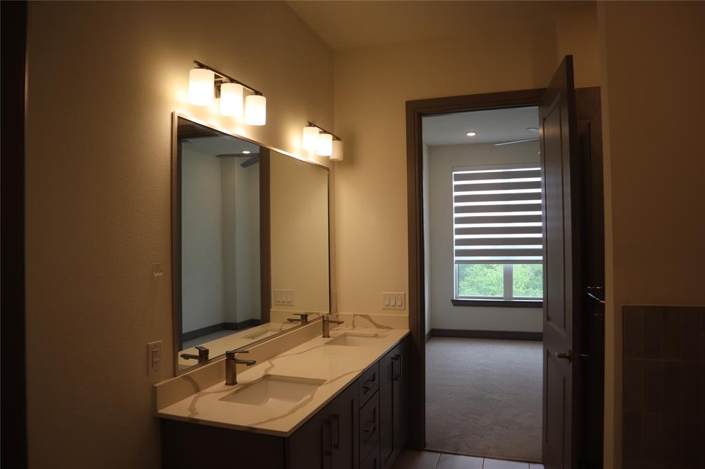 2700 Old Denton Road, Unit 3314 Carrollton, TX 75007 - Photo 4 of 14 a bathroom with a sink and a mirror