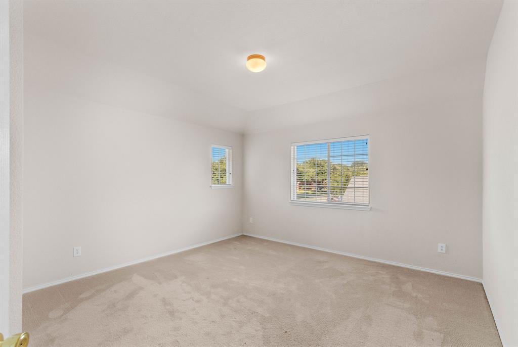 2700 Hereford Road Denton, TX 76210 - Photo 25 of 36 Spacious room featuring neutral carpeting and light-toned walls