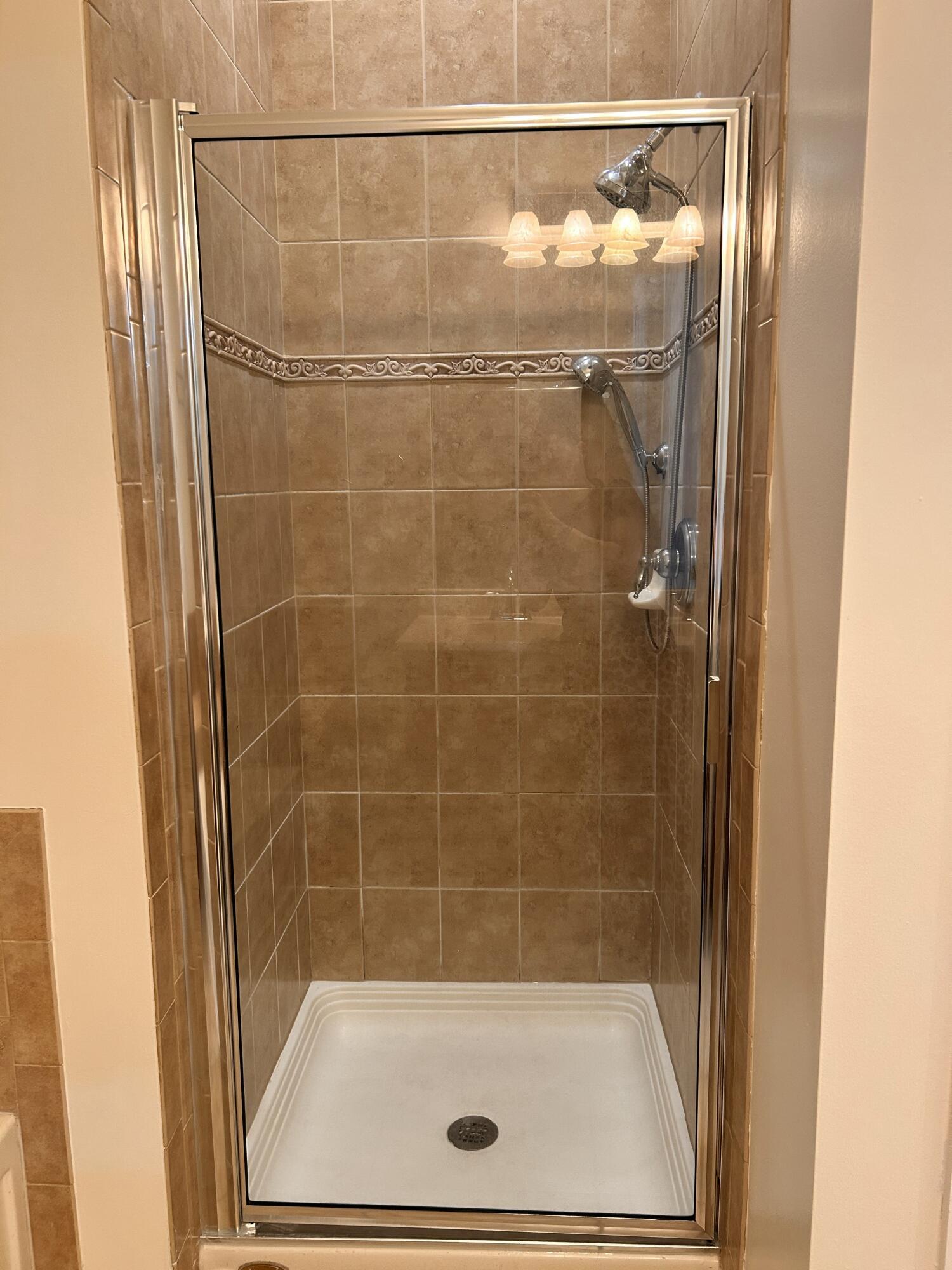 134 Ennis Lane Jupiter, FL 33458 - Photo 11 of 19 a bathroom with a shower