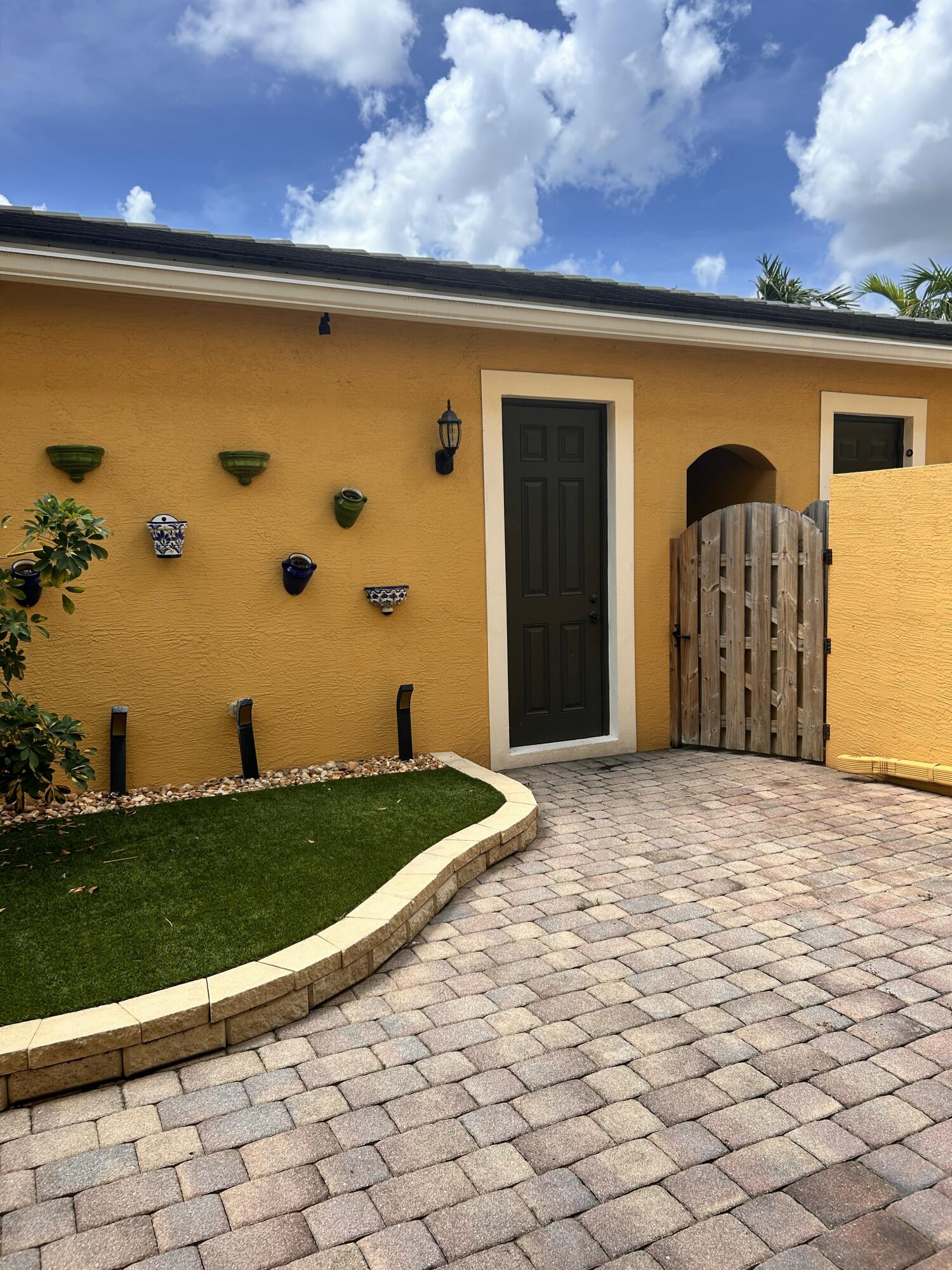 134 Ennis Lane Jupiter, FL 33458 - Photo 16 of 19 a front view of a house with a yard