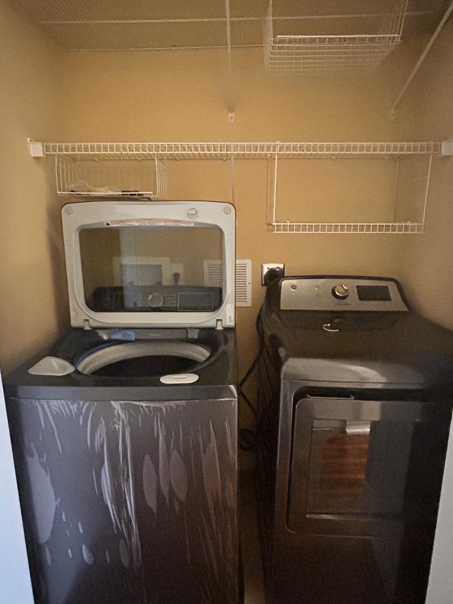 134 Ennis Lane Jupiter, FL 33458 - Photo 18 of 19 a utility room with dryer and washer