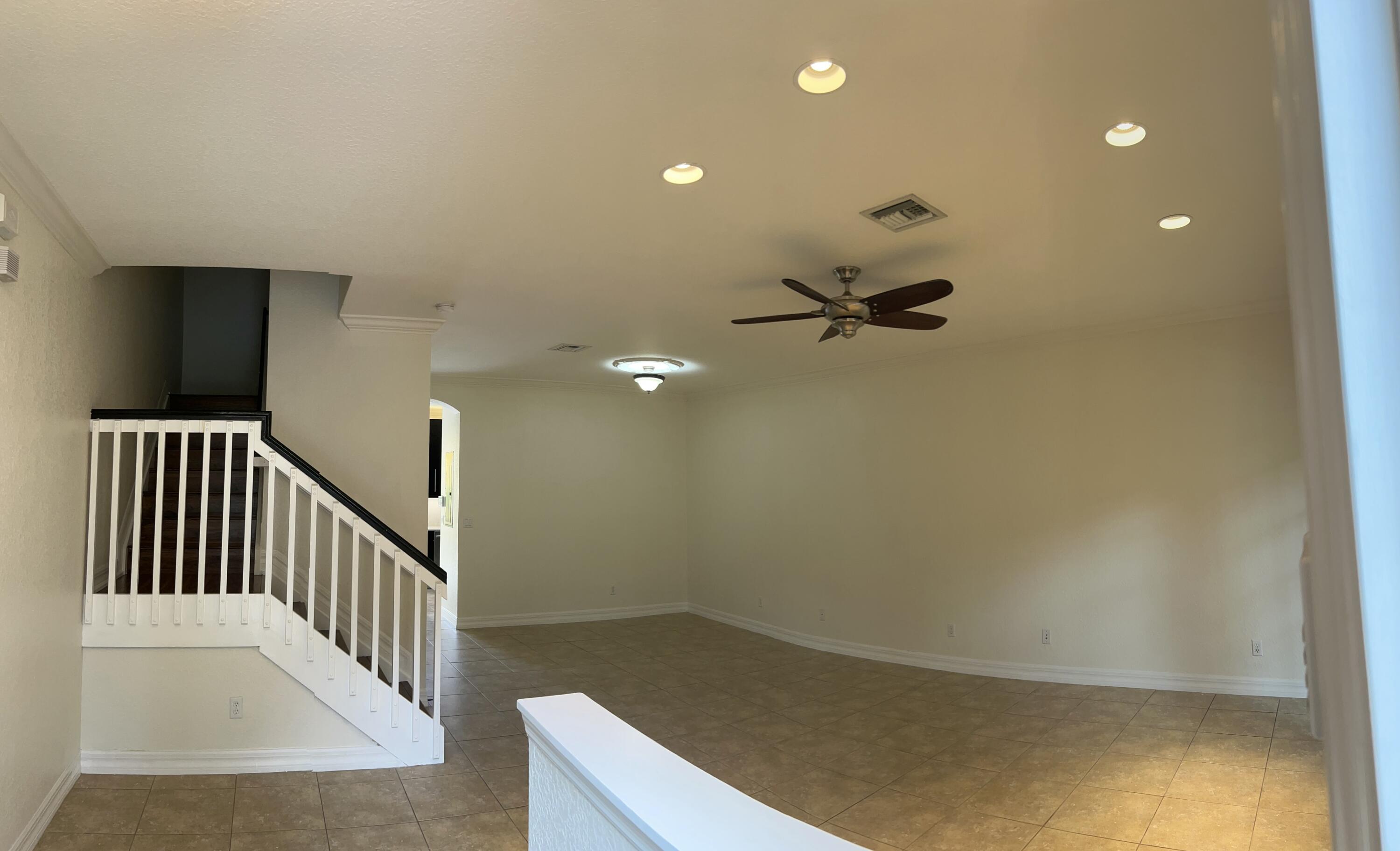134 Ennis Lane Jupiter, FL 33458 - Photo 3 of 19 a view of a livingroom with a staircase