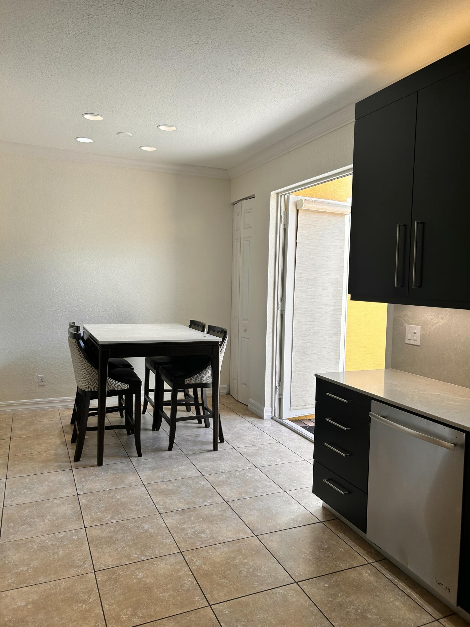 134 Ennis Lane Jupiter, FL 33458 - Photo 7 of 19 a view of a dining room with furniture and a window