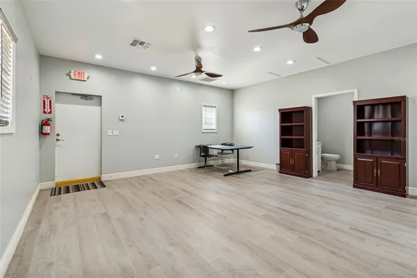 a kitchen with granite countertop white cabinets and sink