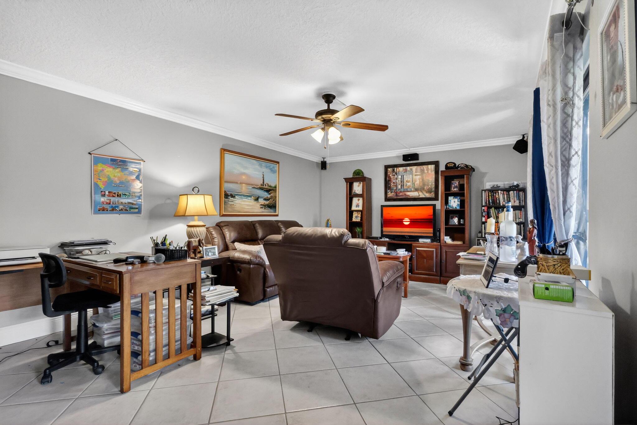 5204 Waterview Circle Palm Springs, FL 33461 - Photo 15 of 30 a living room with furniture and a flat screen tv