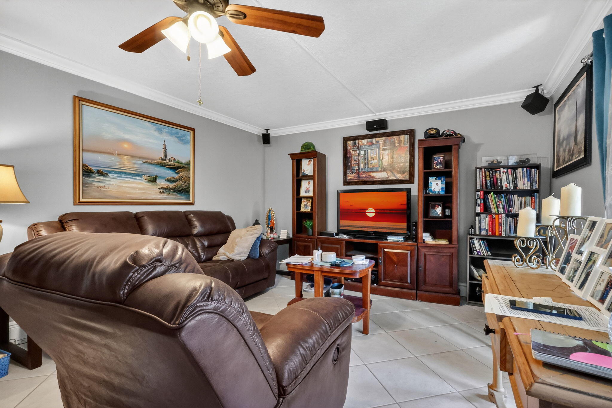 5204 Waterview Circle Palm Springs, FL 33461 - Photo 16 of 30 a living room with furniture and a flat screen tv