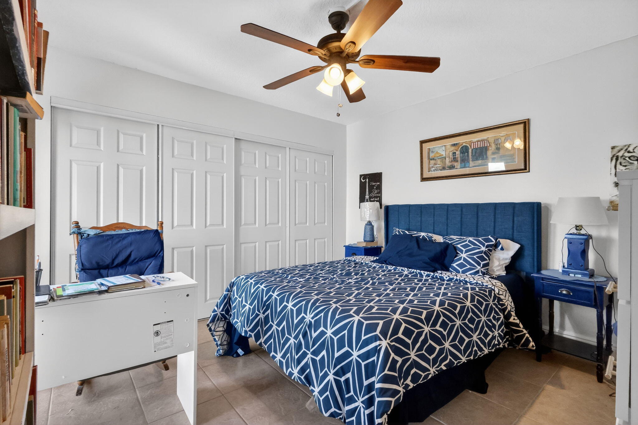 5204 Waterview Circle Palm Springs, FL 33461 - Photo 20 of 30 a bedroom with a large bed and a chandelier