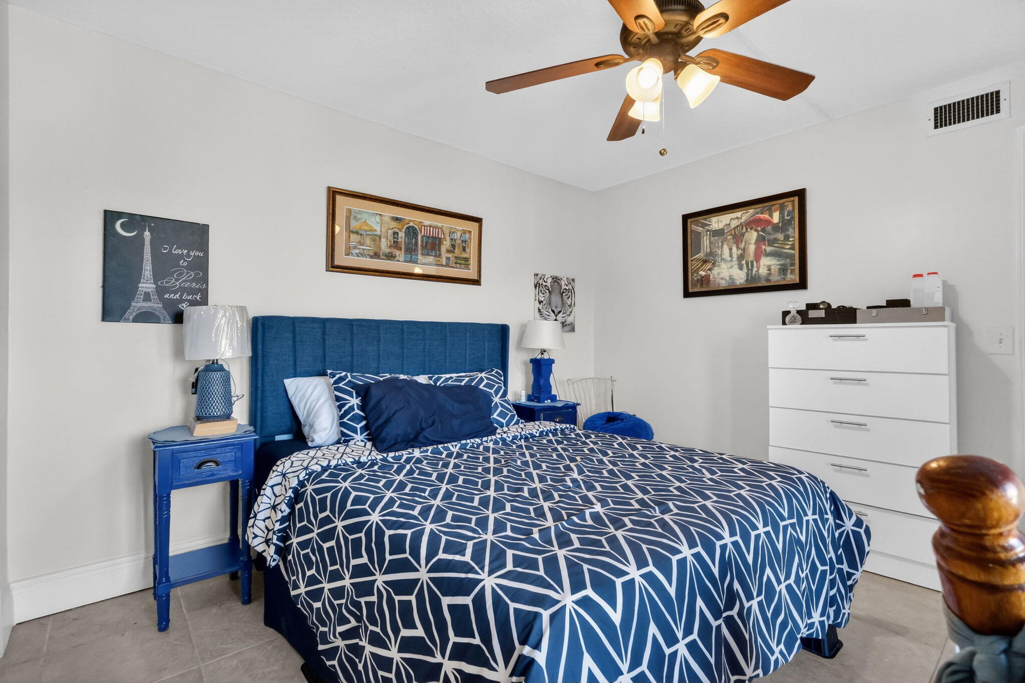 5204 Waterview Circle Palm Springs, FL 33461 - Photo 22 of 30 a bedroom with a bed and a chandelier