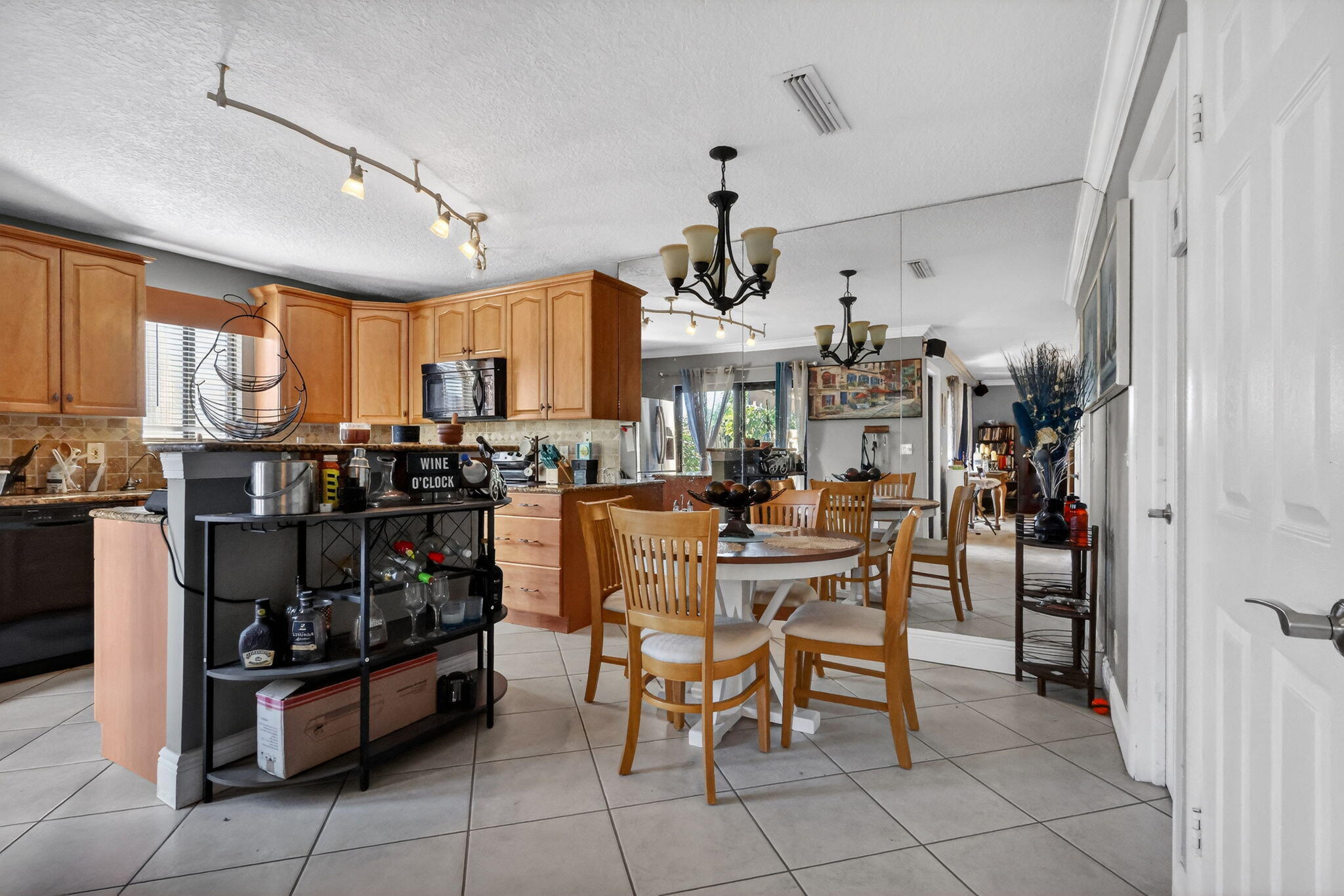 5204 Waterview Circle Palm Springs, FL 33461 - Photo 6 of 30 a view of a kitchen and dining room