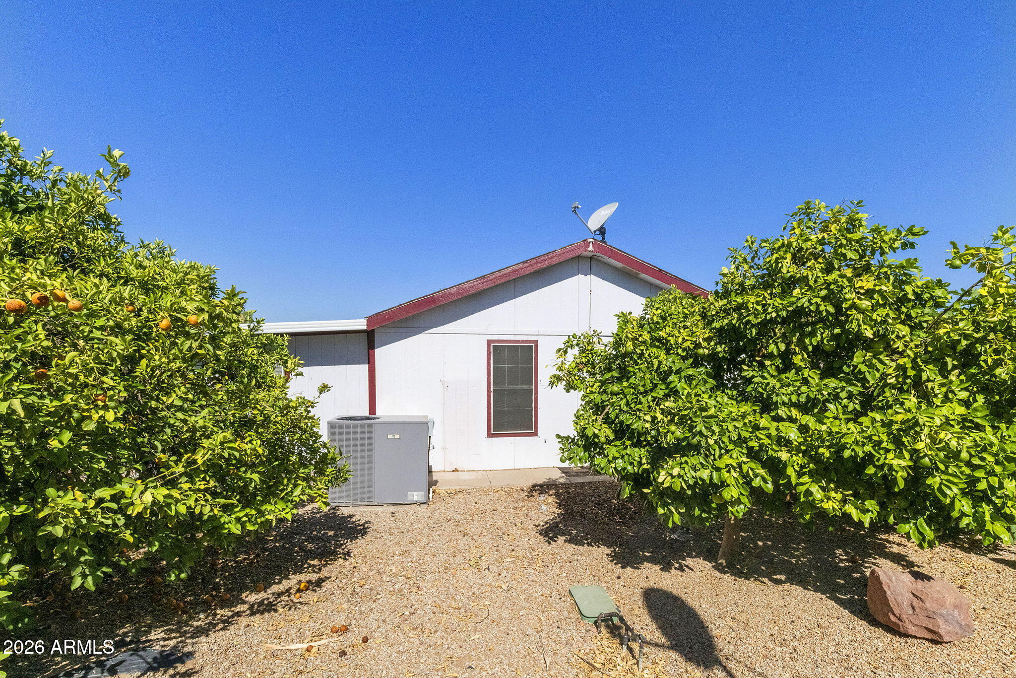 3700 South Tomahawk Road, Unit 73 Apache Junction, AZ 85119 - Photo 19 of 49 a view of a house with a yard