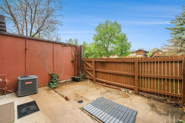 a backyard of a house with a tree