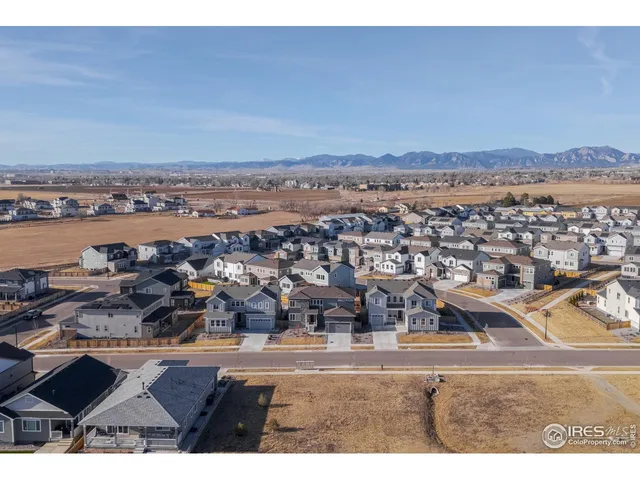 a view of a table and chairs under an umbrella