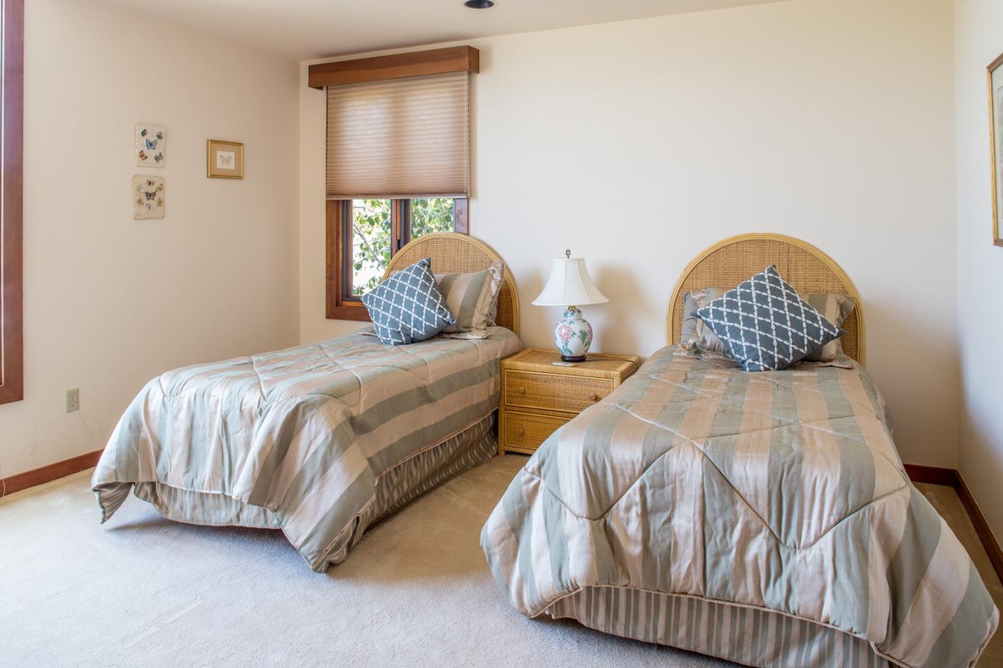 2804 Pradera Road Carmel, CA 93923 - Photo 13 of 19 a bedroom with two beds and painting on the wall