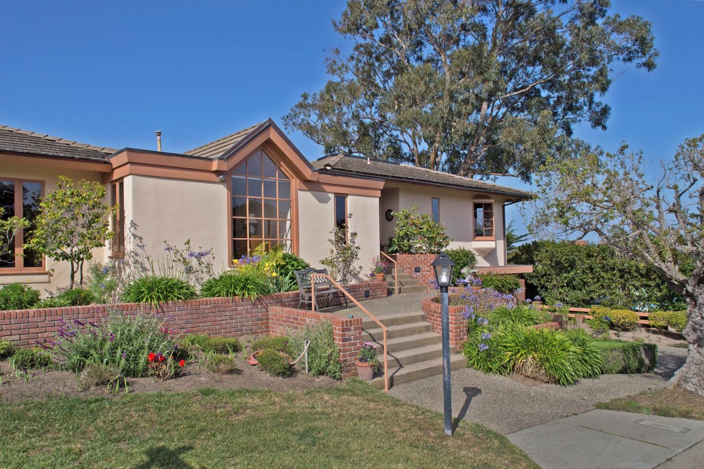 2804 Pradera Road Carmel, CA 93923 - Photo 17 of 19 a view of a house with backyard sitting area and garden