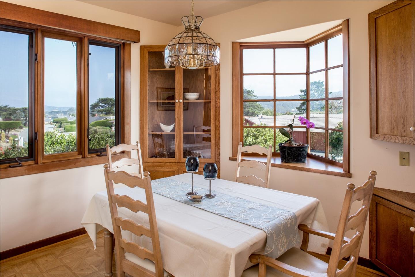2804 Pradera Road Carmel, CA 93923 - Photo 8 of 19 a dining room with a large window and table