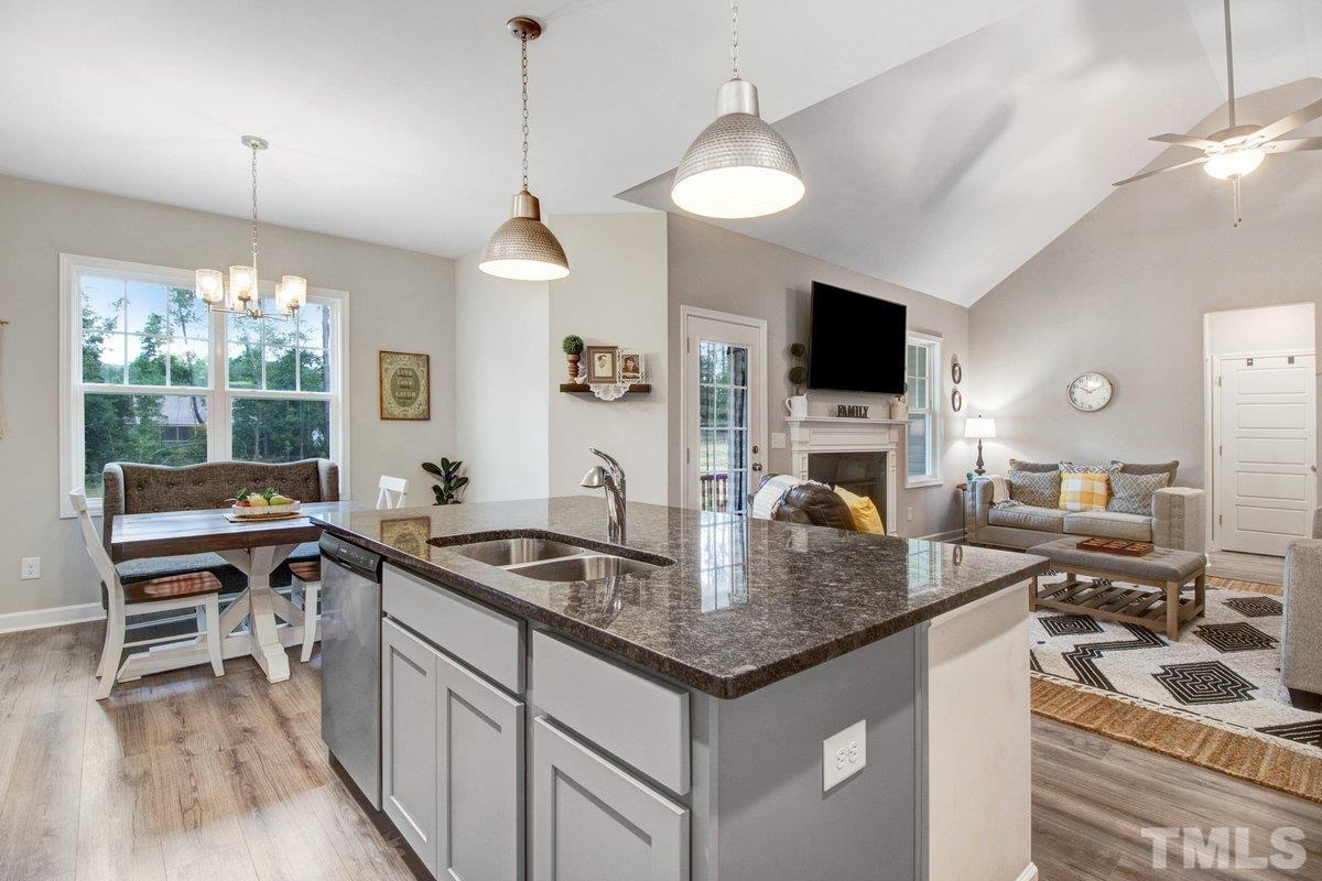 240 Northview Drive Middlesex, NC 27557 - Photo 15 of 40 a kitchen with granite countertop a sink a counter top space appliances and cabinets