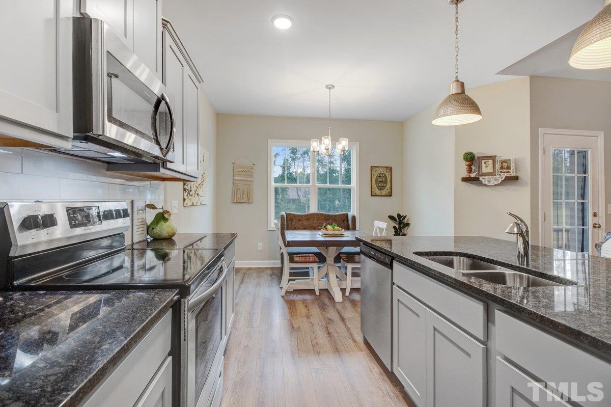 240 Northview Drive Middlesex, NC 27557 - Photo 18 of 40 a kitchen with counter top space a sink appliances and cabinets