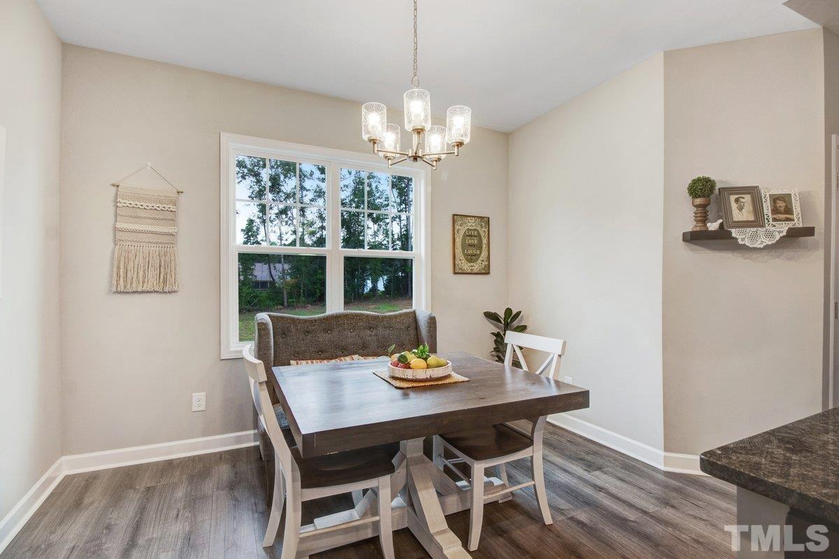 240 Northview Drive Middlesex, NC 27557 - Photo 20 of 40 a view of a dining room with furniture window and wooden floor