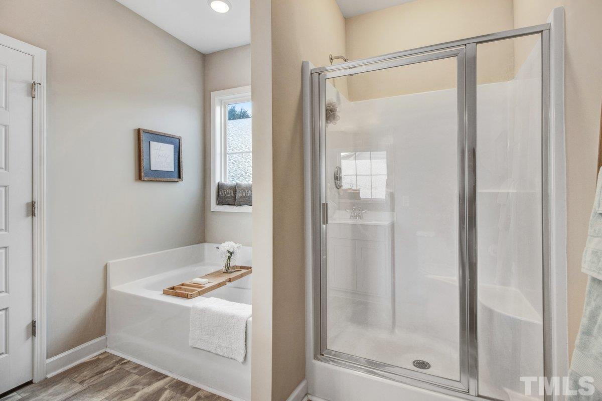 240 Northview Drive Middlesex, NC 27557 - Photo 25 of 40 a bathroom with a bathtub and a shower
