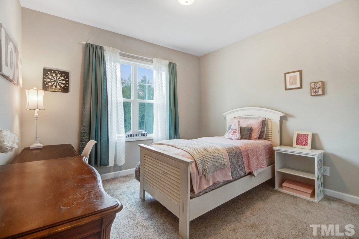 240 Northview Drive Middlesex, NC 27557 - Photo 27 of 40 a bedroom with a bed and a window