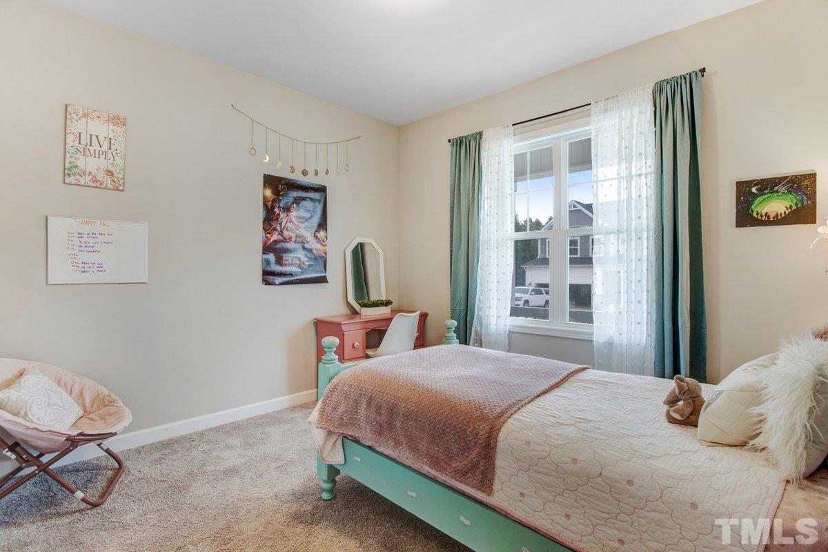 240 Northview Drive Middlesex, NC 27557 - Photo 28 of 40 a bedroom with a bed and a window