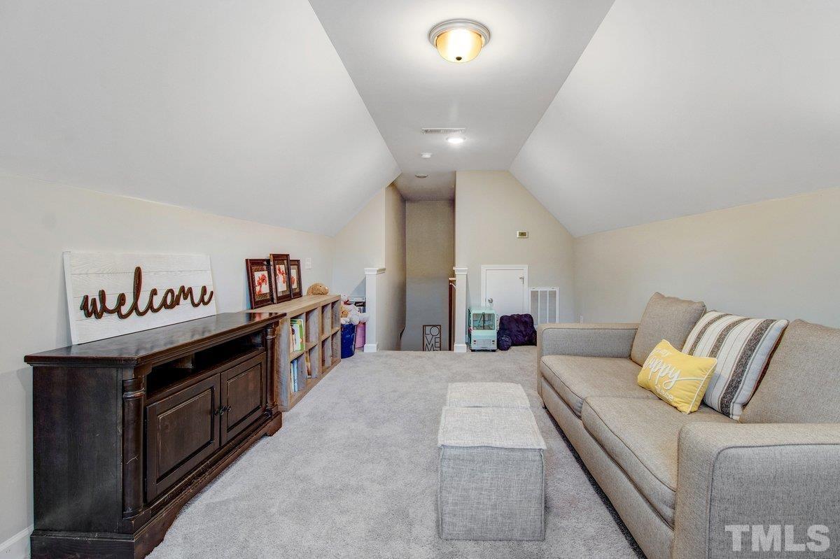 240 Northview Drive Middlesex, NC 27557 - Photo 32 of 40 a living room with furniture and a flat screen tv