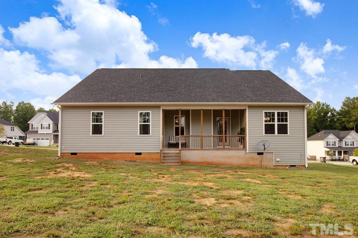 240 Northview Drive Middlesex, NC 27557 - Photo 35 of 40 a front view of a house with a garden and yard