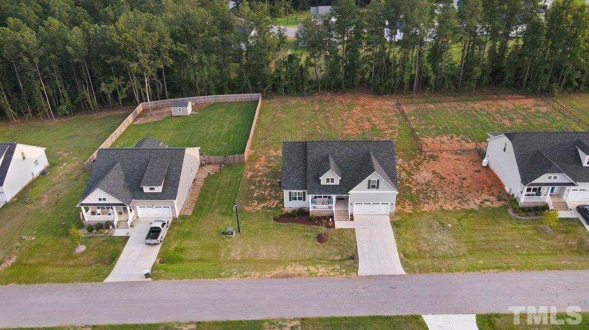240 Northview Drive Middlesex, NC 27557 - Photo 4 of 40 swimming pool view with a garden and trees