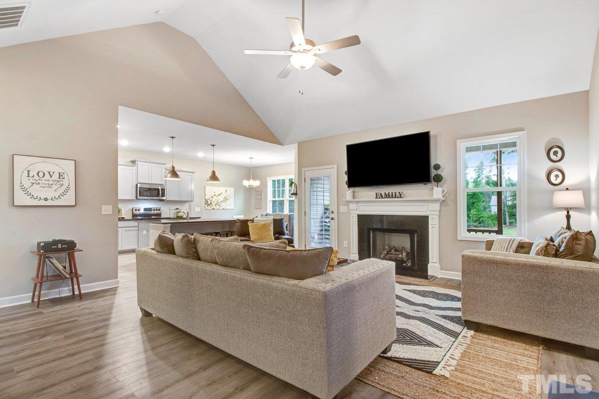 240 Northview Drive Middlesex, NC 27557 - Photo 9 of 40 a living room with furniture fireplace and a flat screen tv