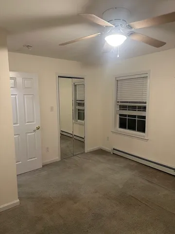 an empty room with a empty space and window