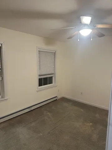 a bathroom with a shower and a bath tub