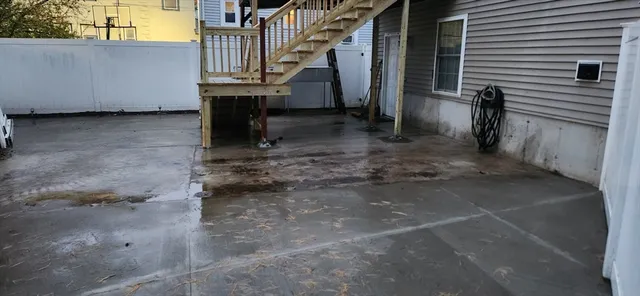 a view of a kitchen with refrigerator and workspace