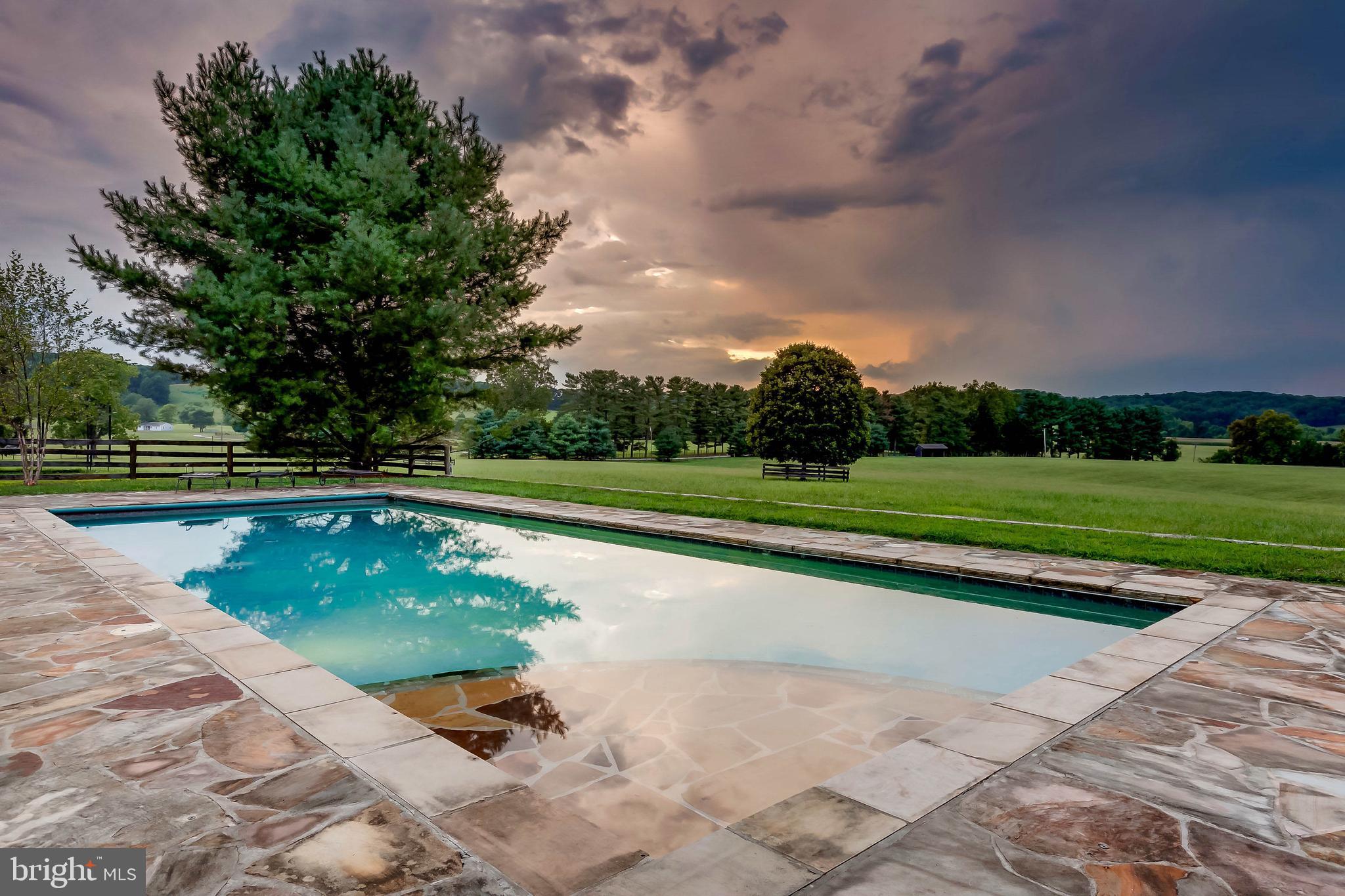 13401 Longnecker Road Reisterstown, MD 21136 - Photo 17 of 58 a view of a swimming pool with a yard